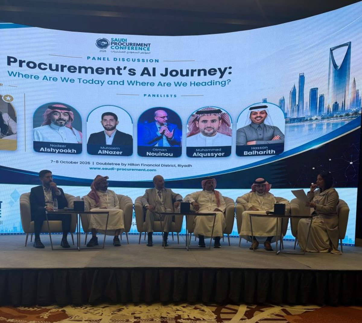 Panel discussion on stage at the Saudi Procurement Conference 2026 titled Procurement's AI Journey, Where Are We Today and Where Are We Heading, with six panelists seated including Otman Nouinou, backed by a large screen showing their photos and names against a Riyadh skyline